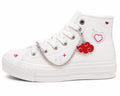 White high-top sneaker styled with Charm'D AF Floating Feelings Edit red cloud shoe charm and silver chain