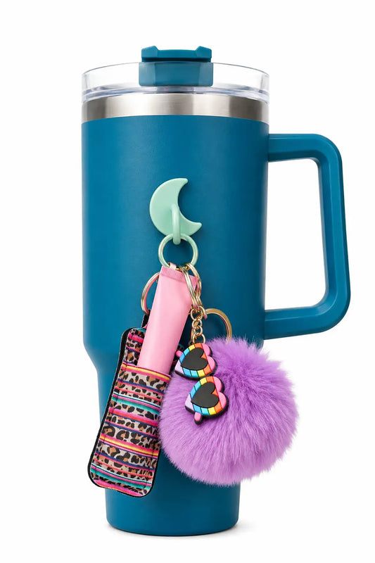 Blue handled tumbler with a mint green crescent moon bottle hook holding personal accessories