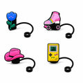 Set of four playful straw charms featuring a blue flower, pink roller skate, cowboy hat and handheld game console