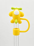 Yellow puppy straw charm with a playful dog design, green bow detail and yellow loop attached to a clear straw on a white background