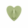 Sage green heart-shaped stick-on charm hook on a white background