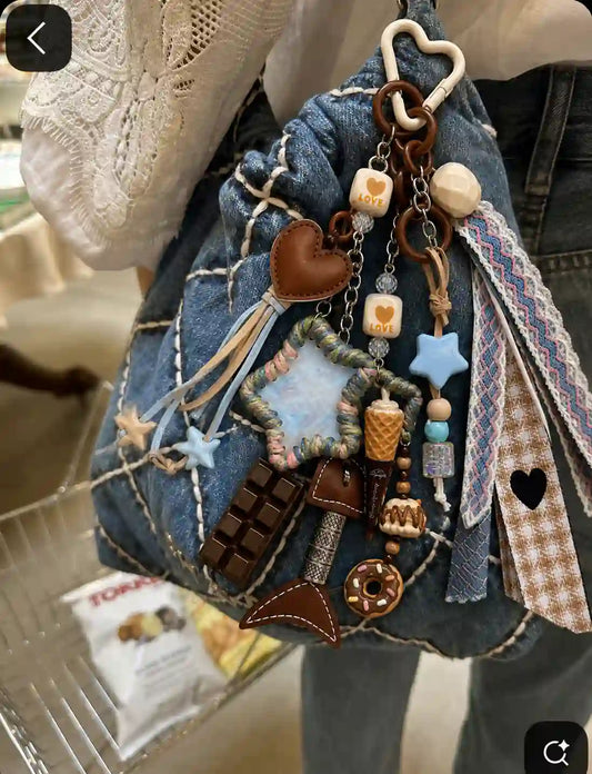 Beach Crush Starfish Bag Charm styled on a blue denim bag with pastel ribbons, starfish charms and layered details