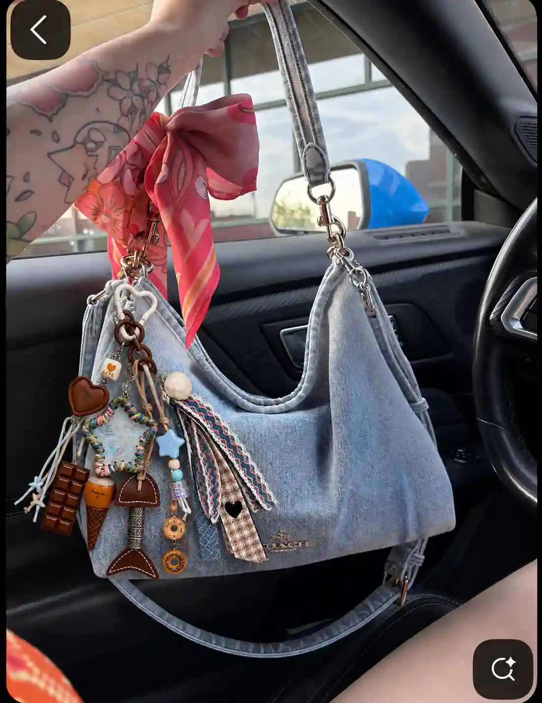 Beach Crush Starfish Bag Charm attached to a light blue handbag with pastel ribbons and coastal-inspired charms