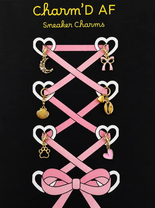 Charm'D AF Girlhood Edit gold shoe charm bundle showing crystal moon, bow, shell, paw print and pink heart charms