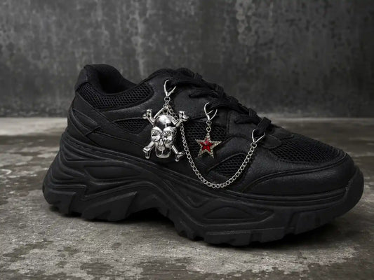 Black sneaker styled with silver skull and red glitter star shoe charms connected by silver chain