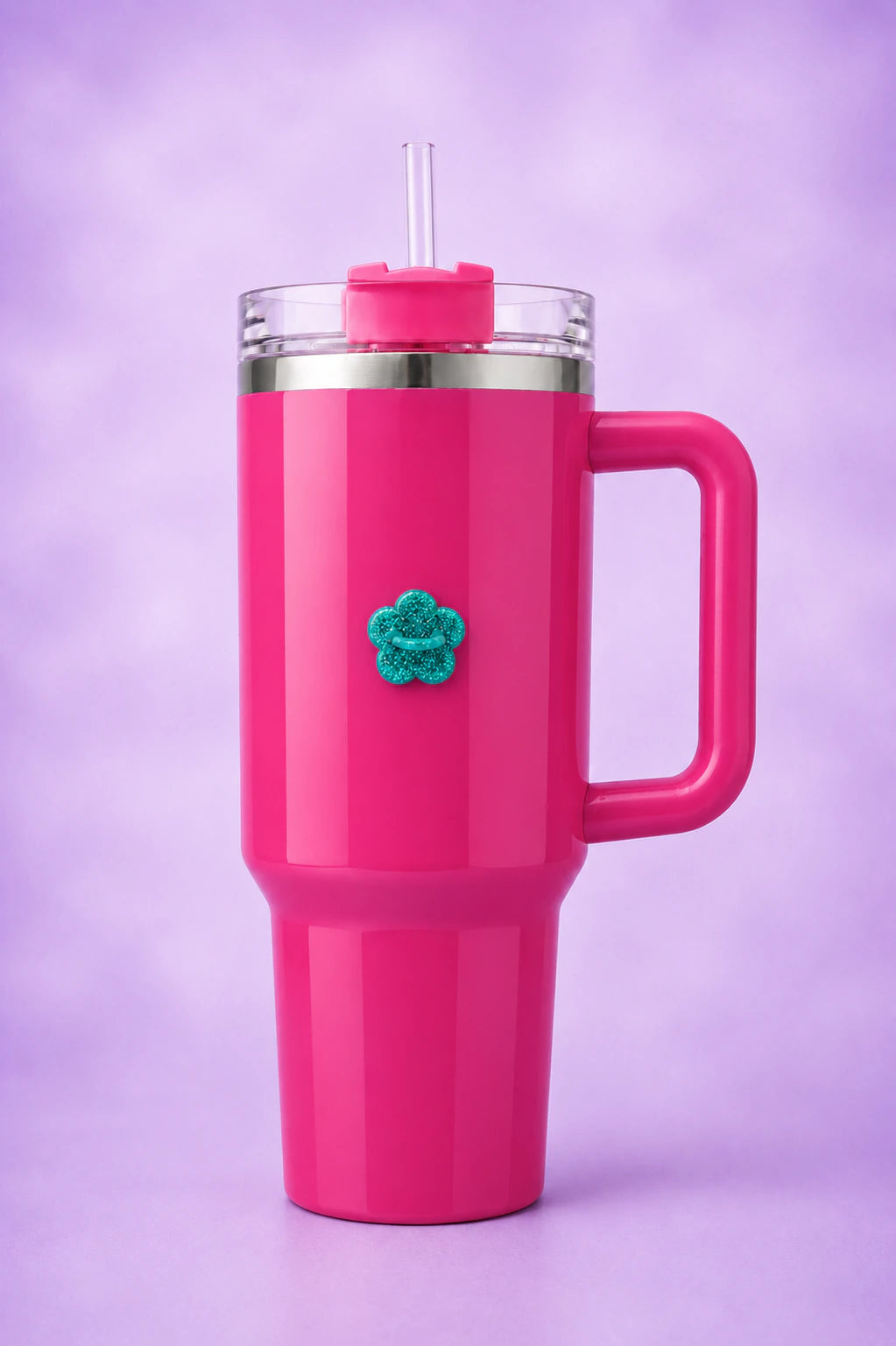 Bright pink handled tumbler with a teal glitter flower bottle hook