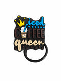 Iced Coffee Queen straw charm with blue lettering, coffee cup graphic and crown on a black background