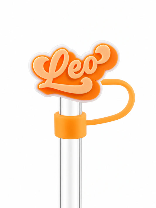Leo zodiac straw charm with peach lettering and orange detailing on a clear straw