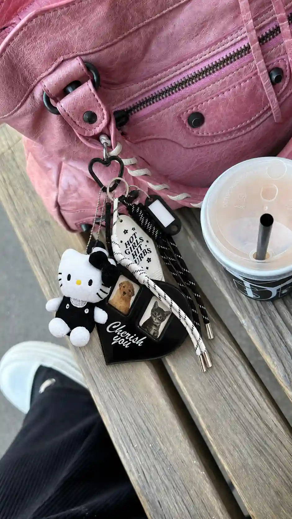 Midnight Album Kitty Bag Charm attached to a pink handbag with a plush kitty, heart charm and black white cords