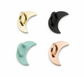 Four crescent moon-shaped bottle hooks in gold, black, mint green and rose gold