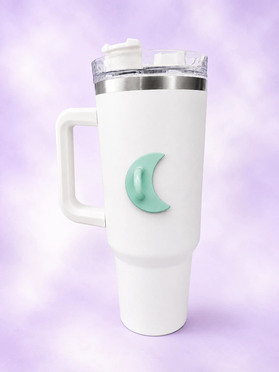 White handled tumbler with a mint green crescent moon bottle hook