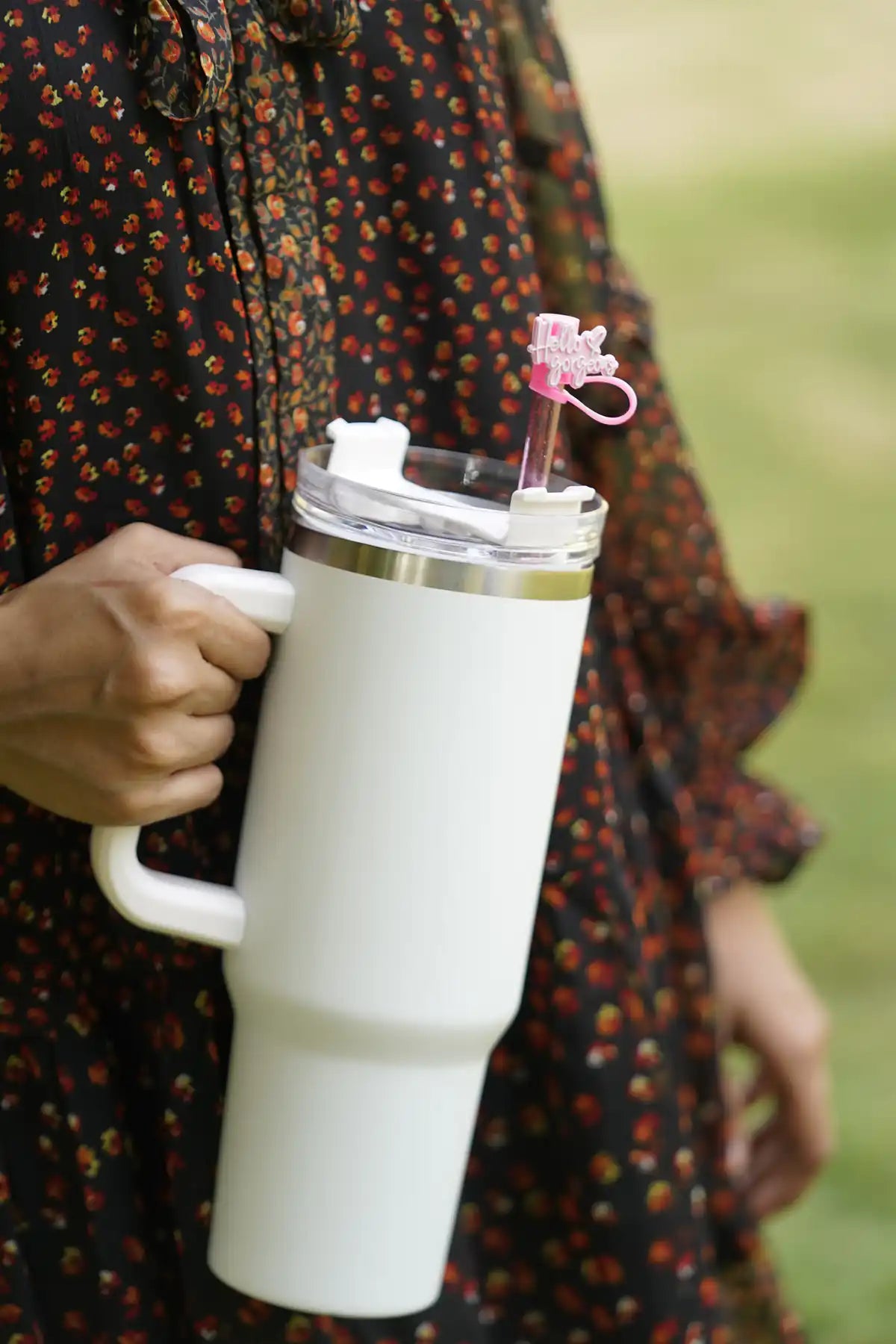 Hello Gorgeous pink straw charm attached to a white tumbler