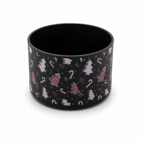 Black water bottle boot with a pink-and-white Christmas pattern featuring candy canes, Christmas trees, snowflakes, and festive details, shown on a white background.