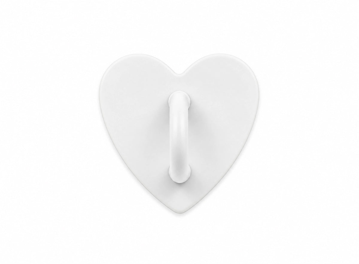 White heart-shaped stick-on charm hook on a white background