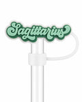 Sagittarius zodiac straw charm with mint green lettering and dark green detailing on a clear straw
