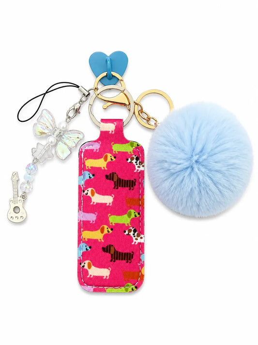 IT Girl Puppy Love Bundle with puppy-print bottle charm, fluffy blue pom pom, heart clip, butterfly charm and guitar keychain
