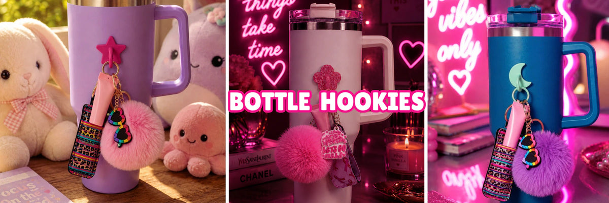 Charm'D AF bottle hookies with fluffy pom poms and playful charms styled on pastel drinkware